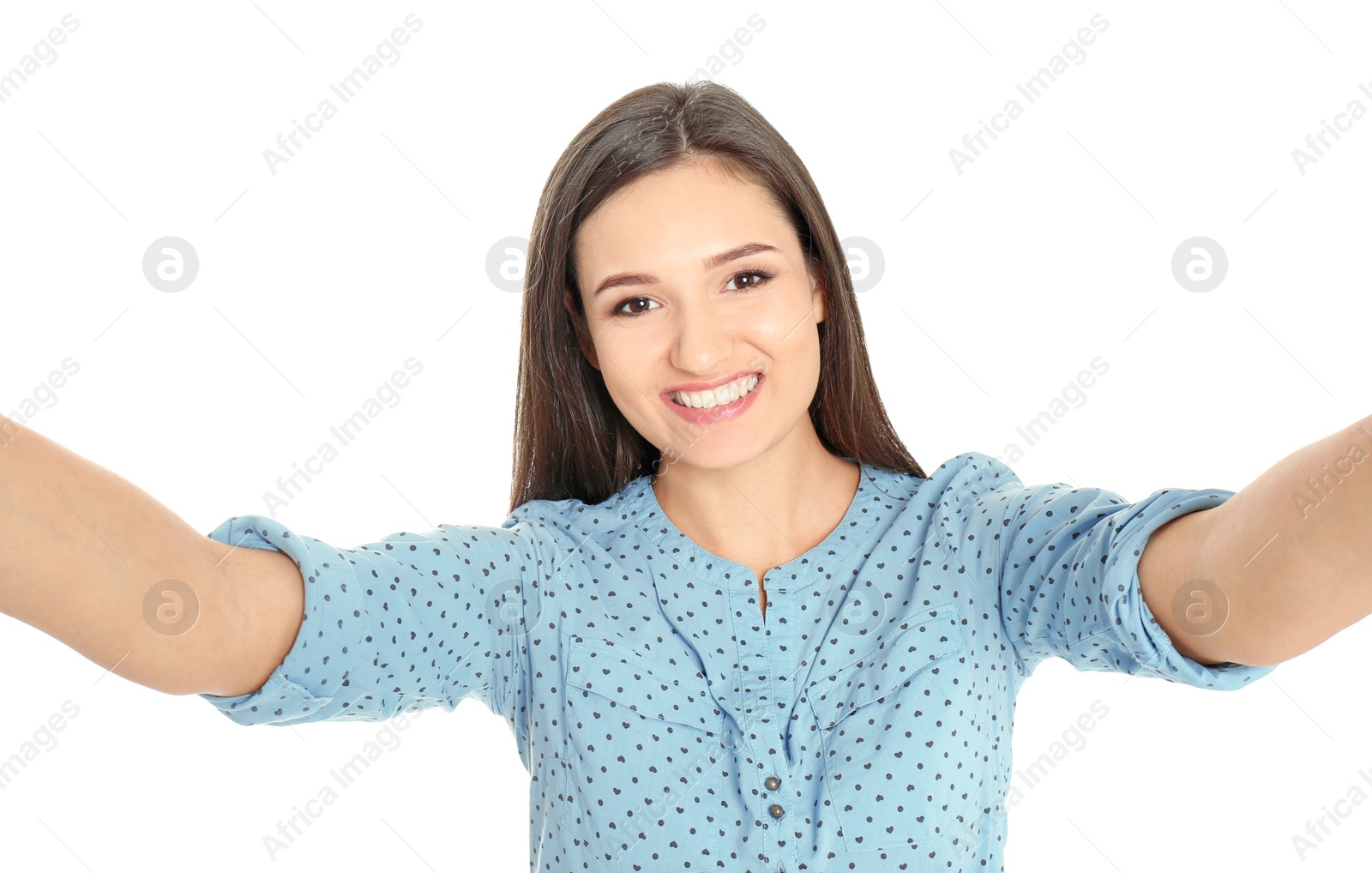 Photo of Young beautiful woman taking selfie against white background