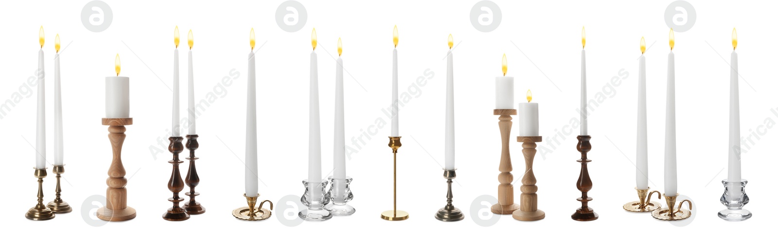 Image of Set of different stylish candlesticks with burning candles on white background, banner design