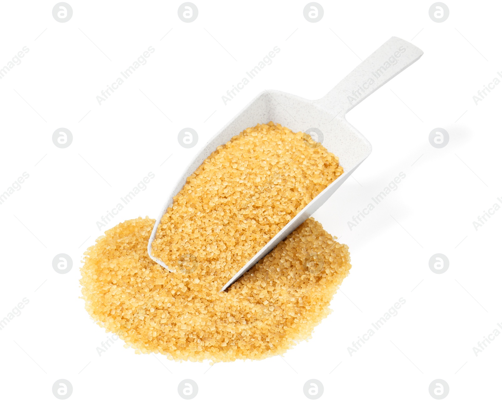 Photo of Pile of brown sugar and scoop isolated on white