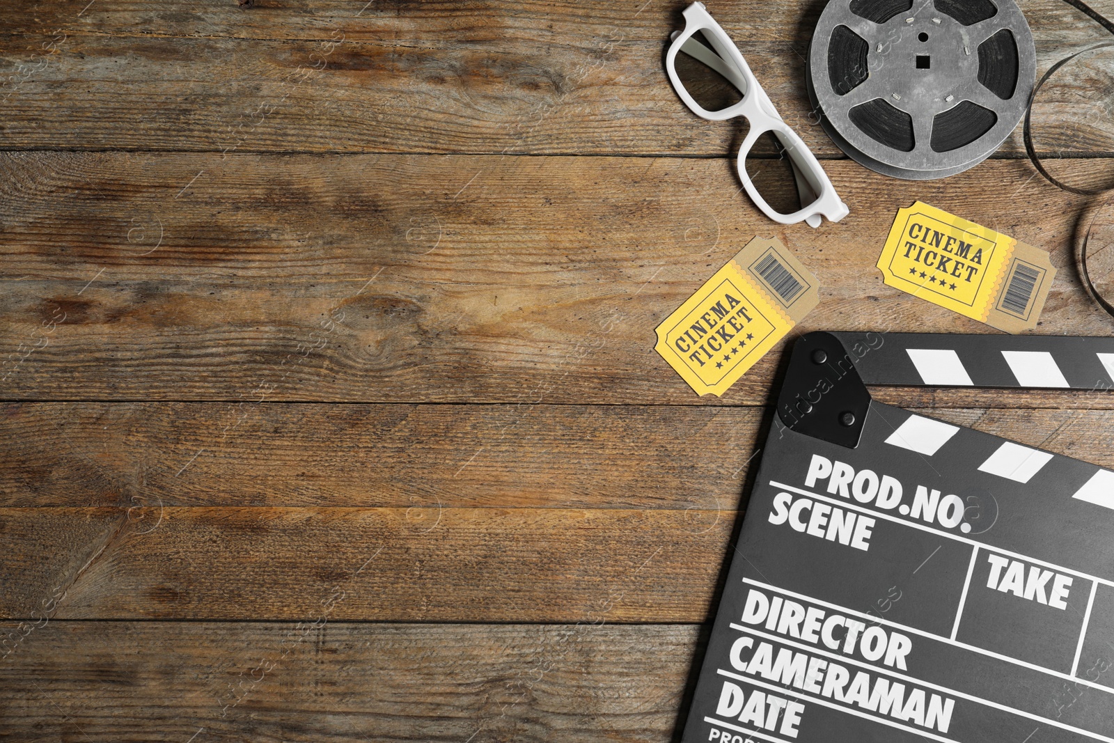 Photo of Flat lay composition with clapperboard, cinema tickets and 3d glasses on wooden table, space for text