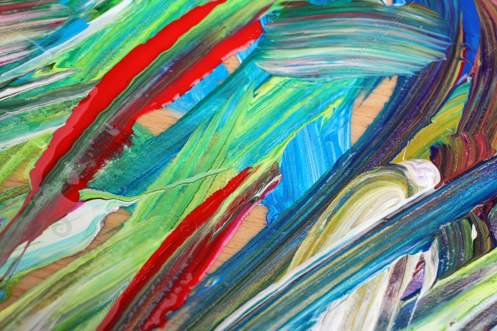 Photo of Abstract colorful acrylic paint as background, top view