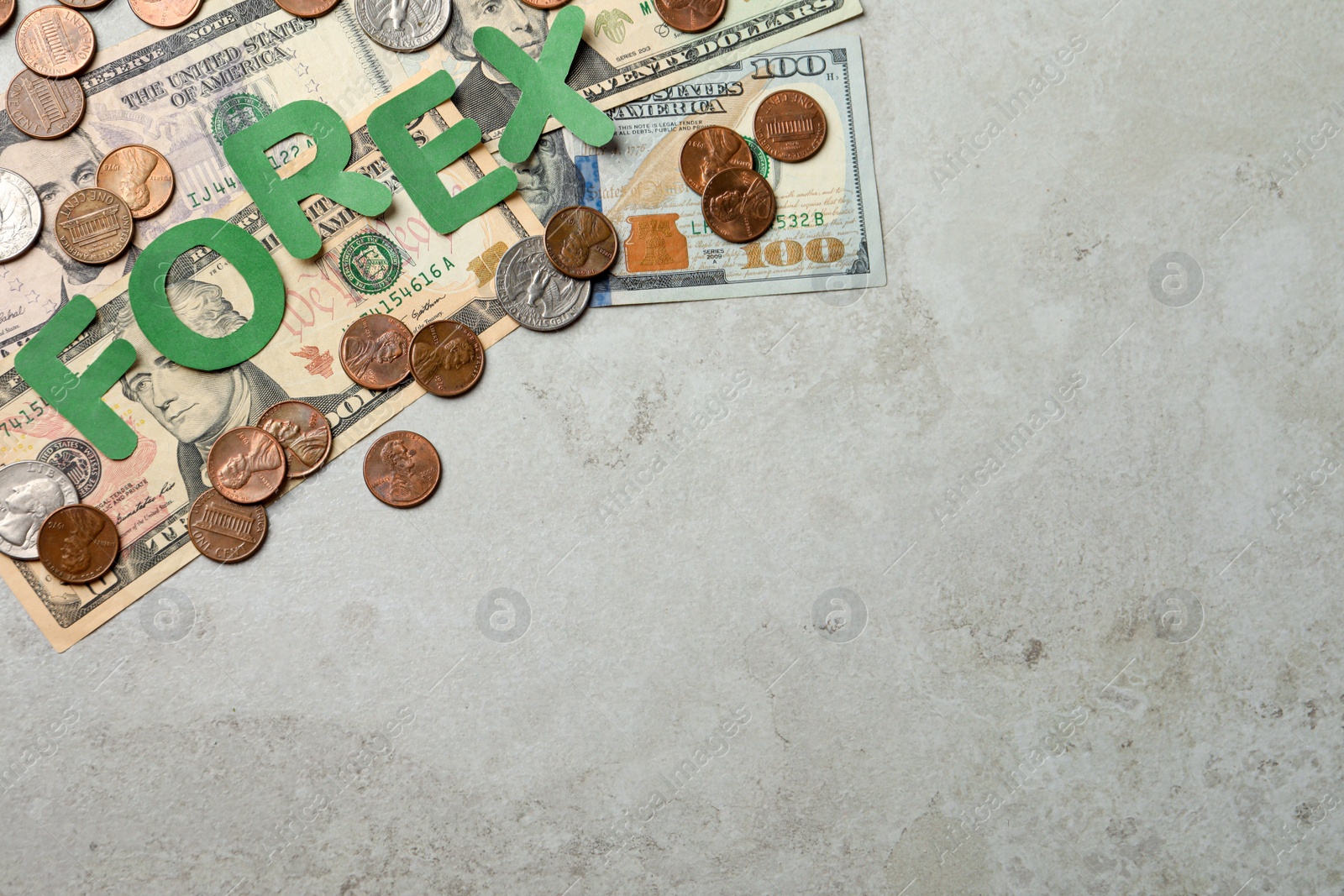 Photo of Word Forex made of green letters with coins and banknotes on light grey table, flat lay. Space for text