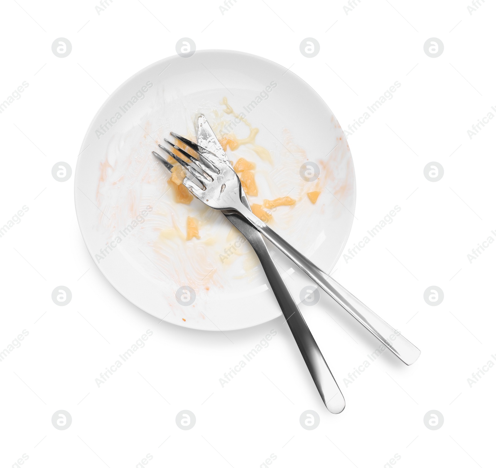 Photo of Dirty plate and cutlery on white background, top view