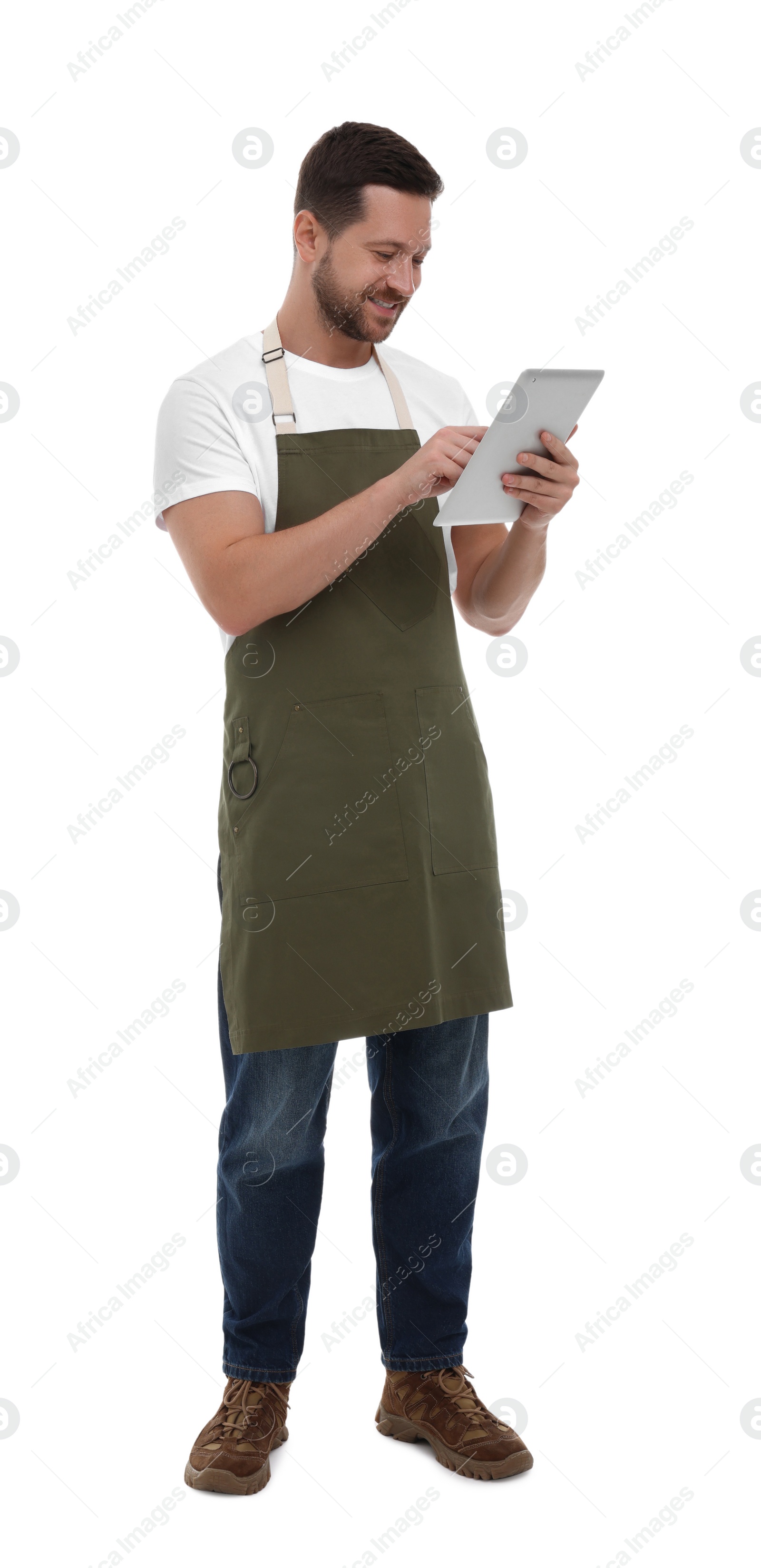 Photo of Smiling man using tablet on white background