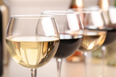 Photo of Different sorts of wine in glasses, closeup