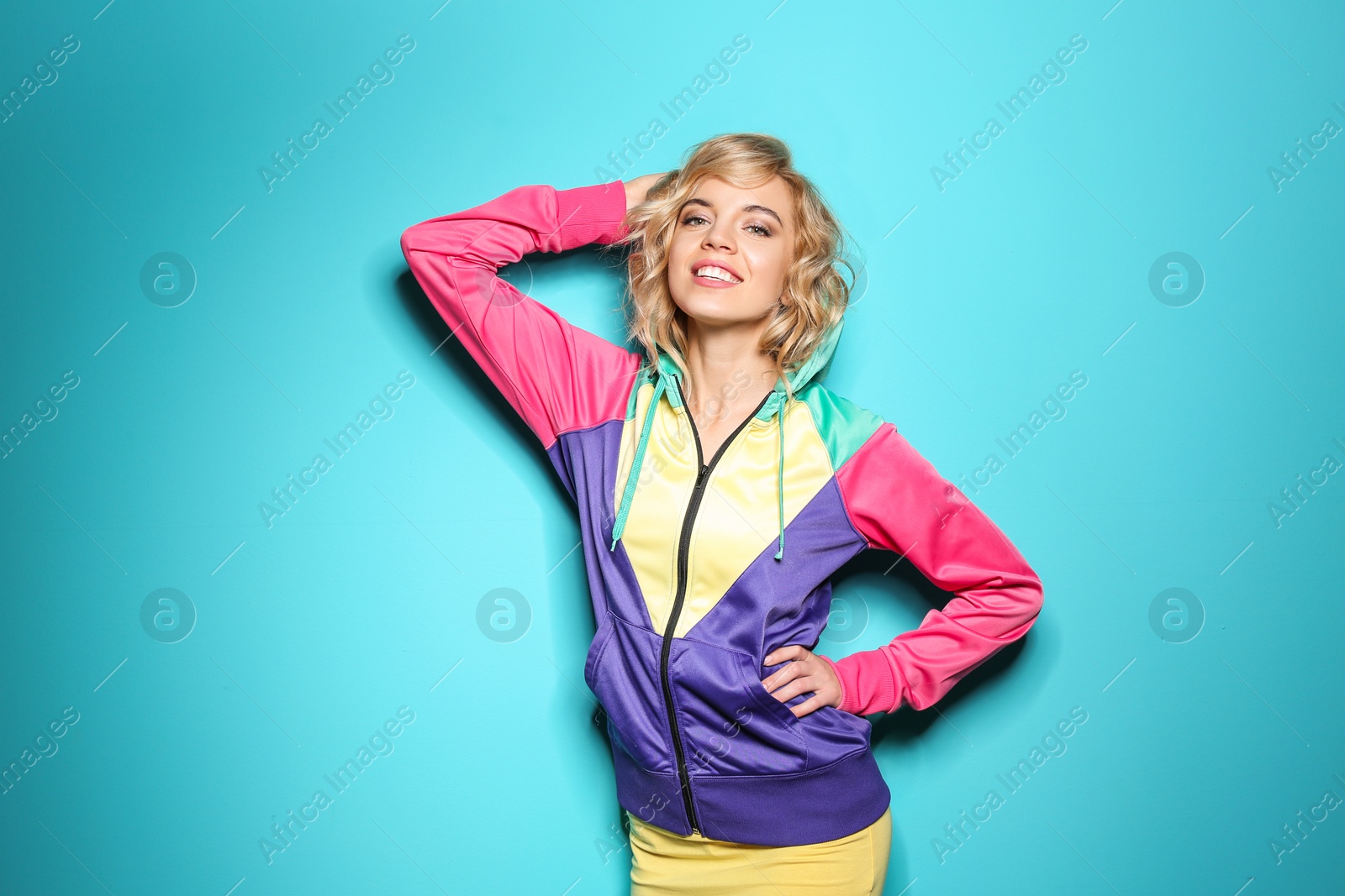 Photo of Stylish young woman posing on color background