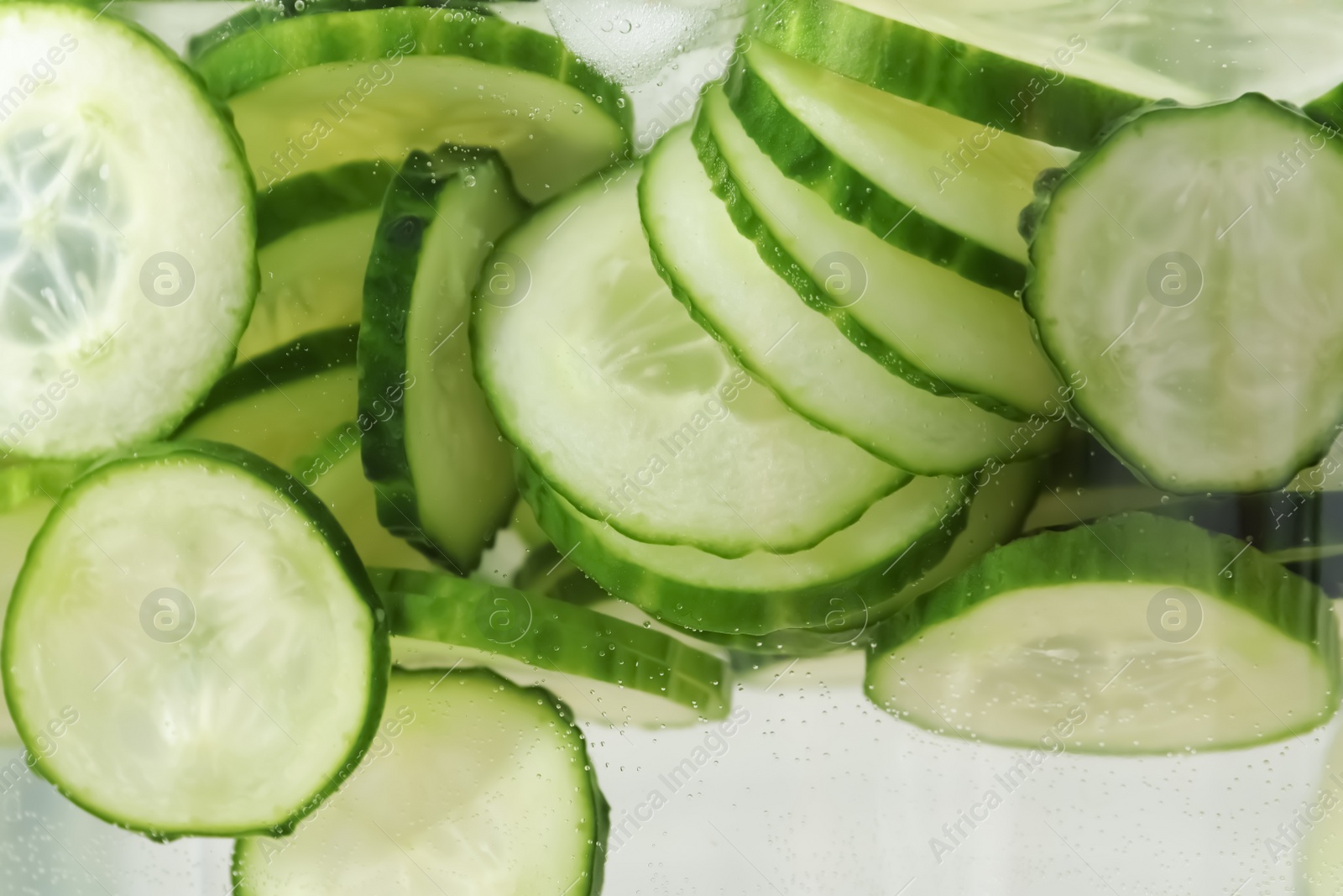 Photo of Large jar of fresh cucumber water, closeup