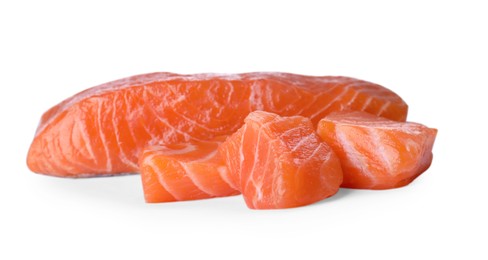 Pieces of fresh raw salmon on white background