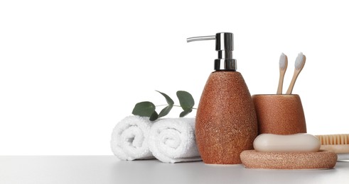 Photo of Bath accessories. Different personal care products and eucalyptus branch on table against white background. Space for text