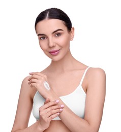 Beautiful woman with smear of body cream on her hand against white background