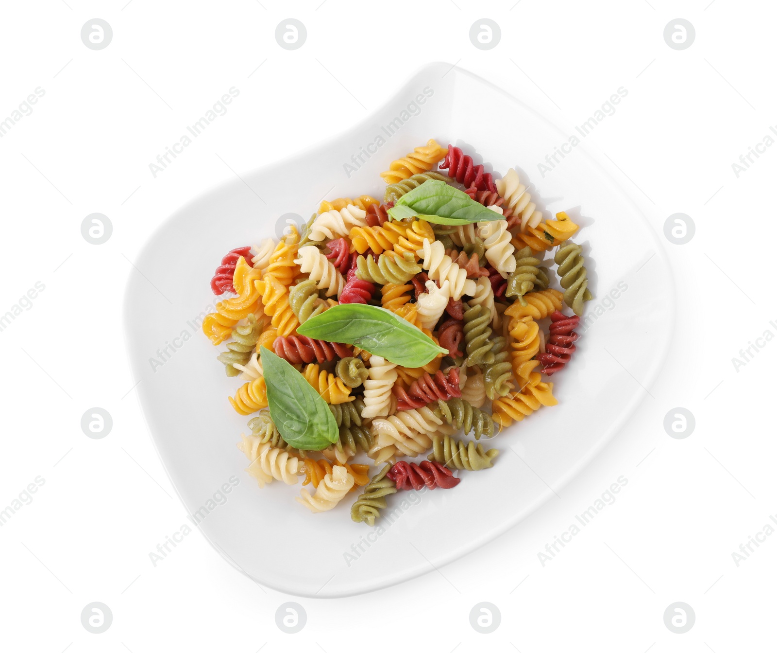 Photo of Delicious vegetable spiraline pasta with basil isolated on white