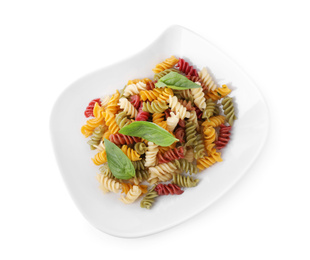 Delicious vegetable spiraline pasta with basil isolated on white