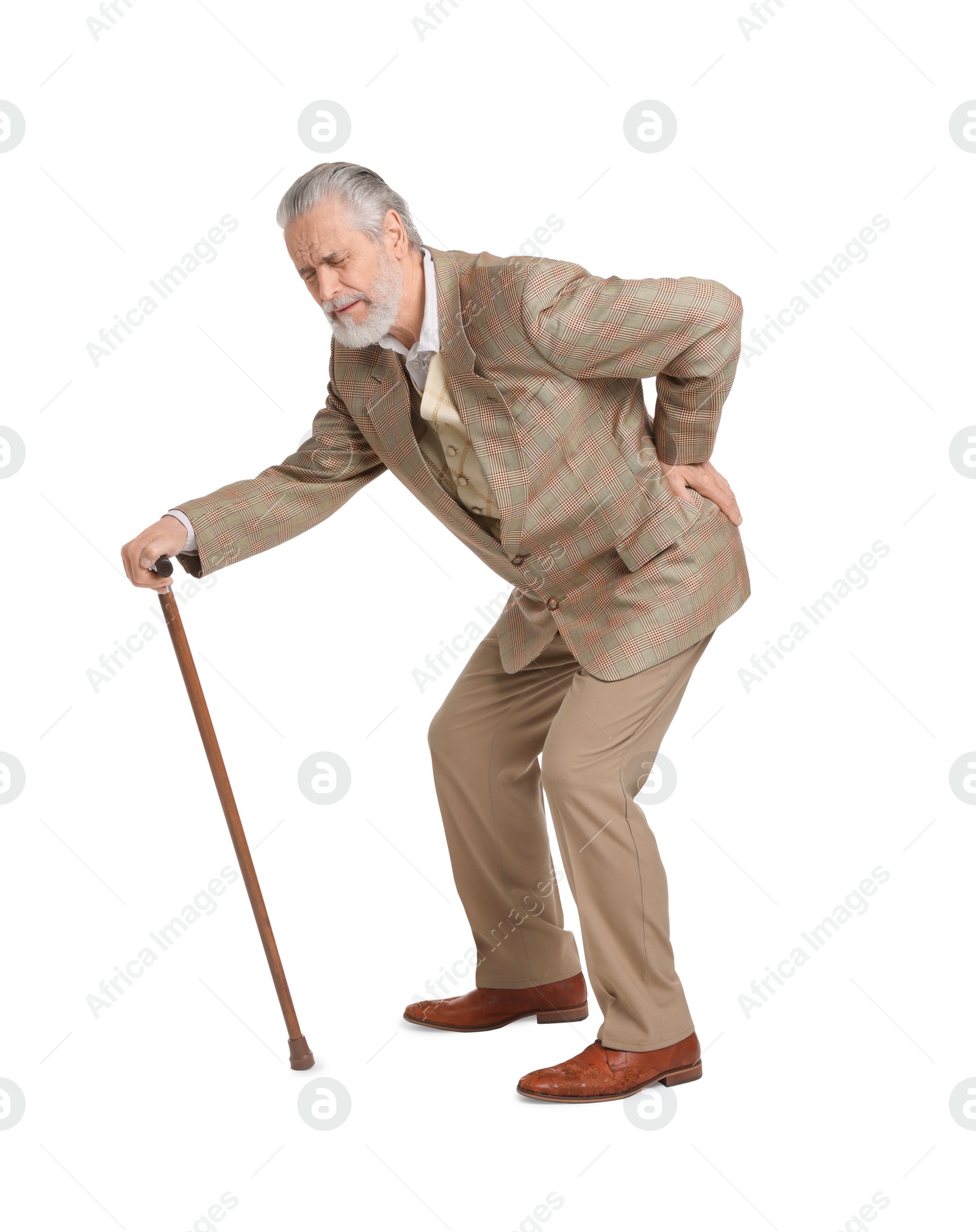 Photo of Senior man with walking cane suffering from back pain on white background