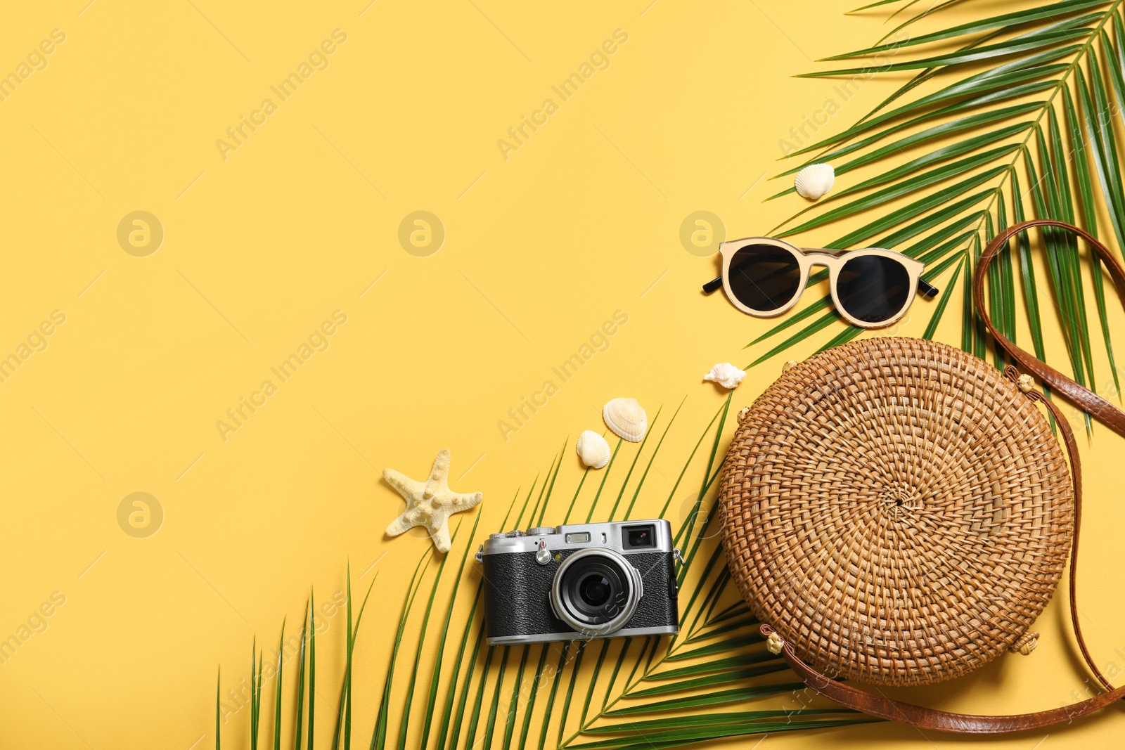 Photo of Flat lay composition with beach accessories on color background. Space for text