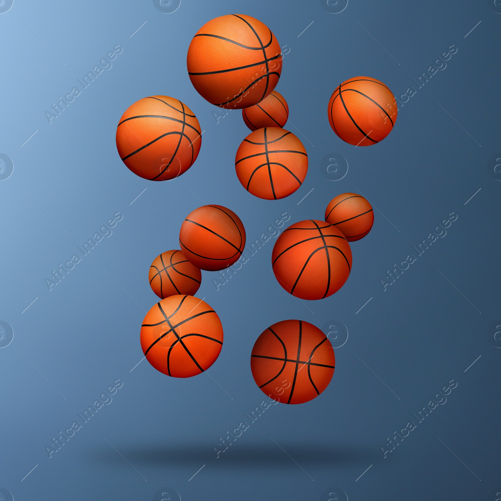 Image of Many basketball balls falling on steel blue gradient background