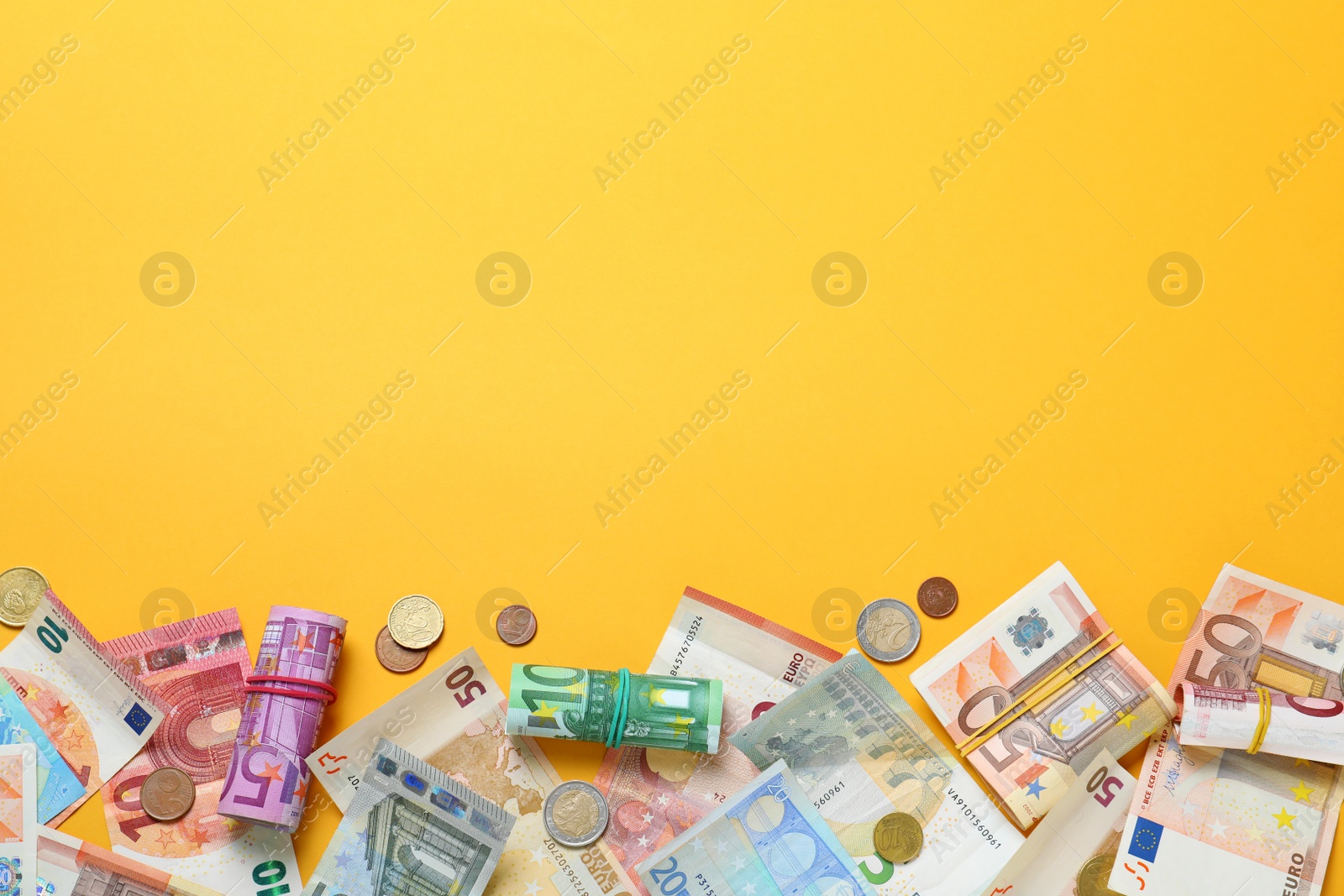 Image of Money on yellow background, flat lay. Space for text 