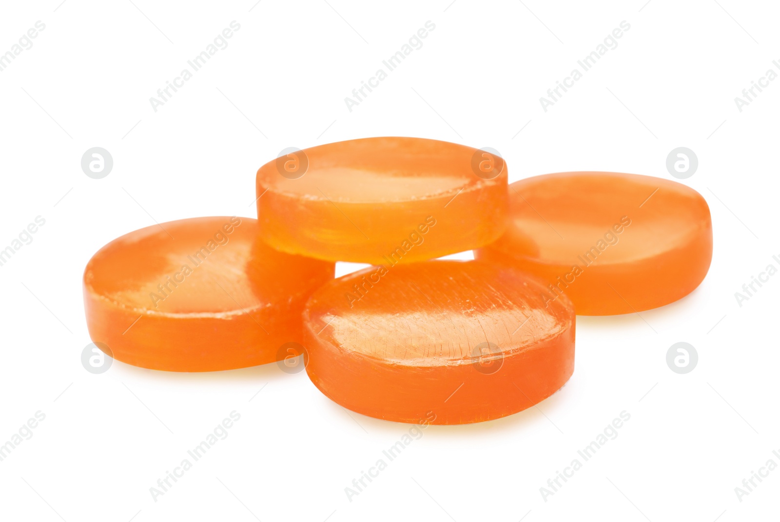 Photo of Orange cough drops on white background. Pharmaceutical product