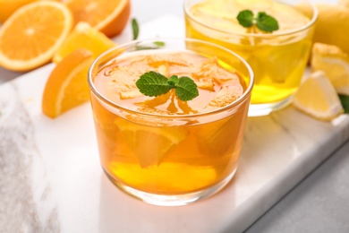 Glasses of tasty jelly served on light table