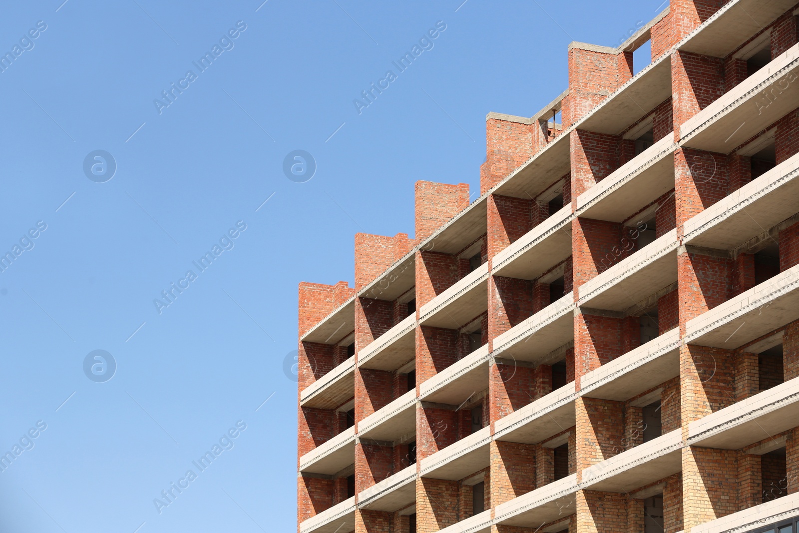 Photo of View of unfinished building against blue sky