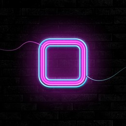 Image of Glowing neon number 0 sign on brick wall