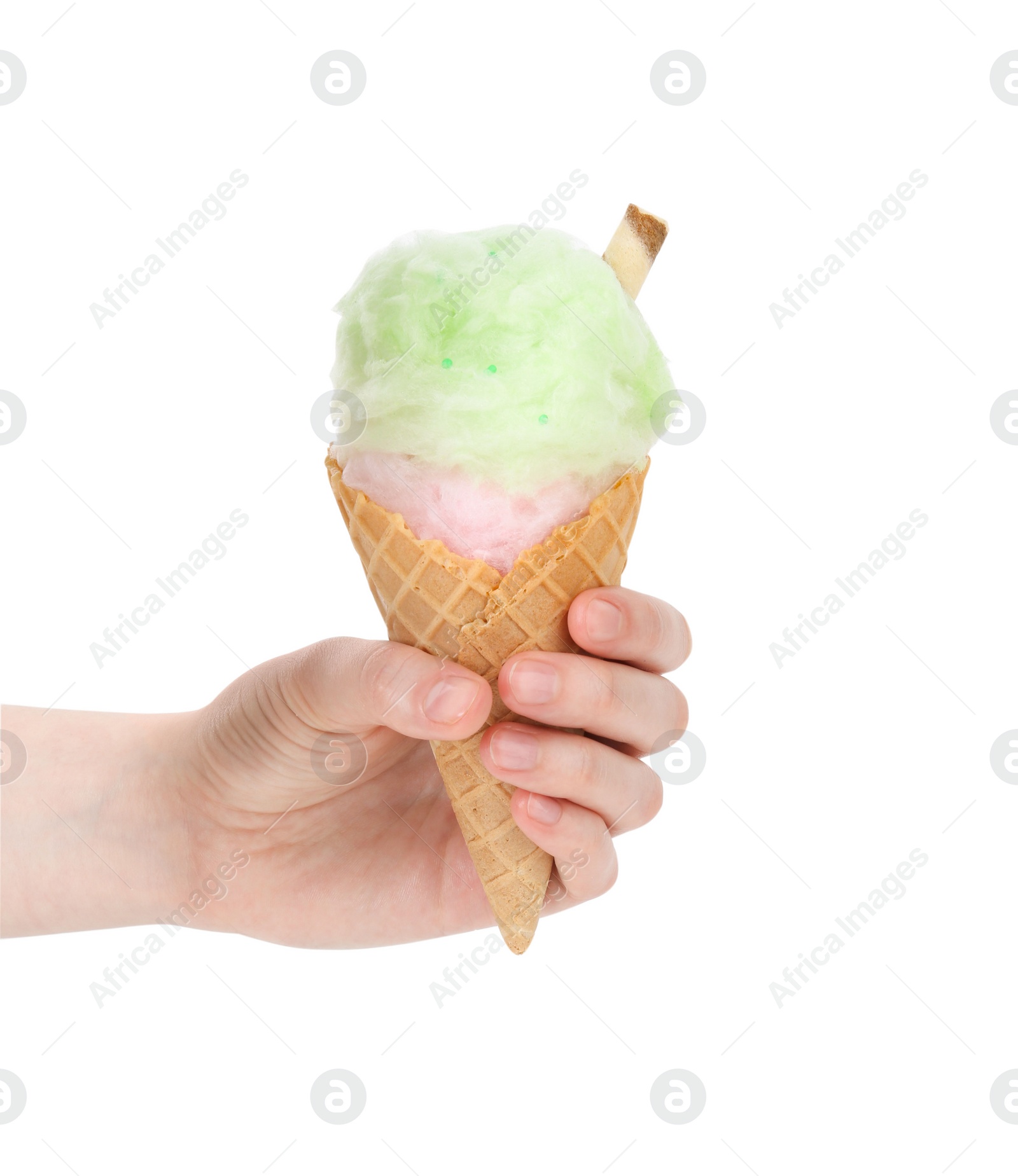 Photo of Woman holding waffle cone with cotton candy on white background, closeup