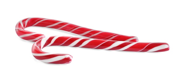 Photo of Sweet Christmas candy canes on white background
