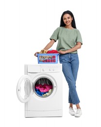 Photo of Beautiful woman with laundry basket near washing machine on white background