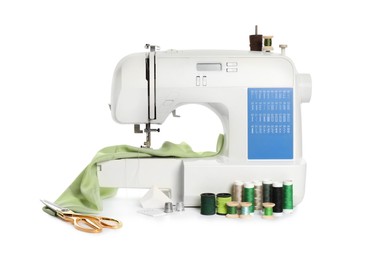 Modern sewing machine with light green cloth and craft accessories isolated on white