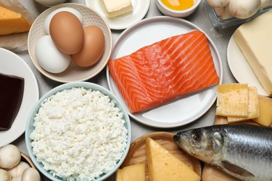 Photo of Fresh products rich in vitamin D on table, flat lay