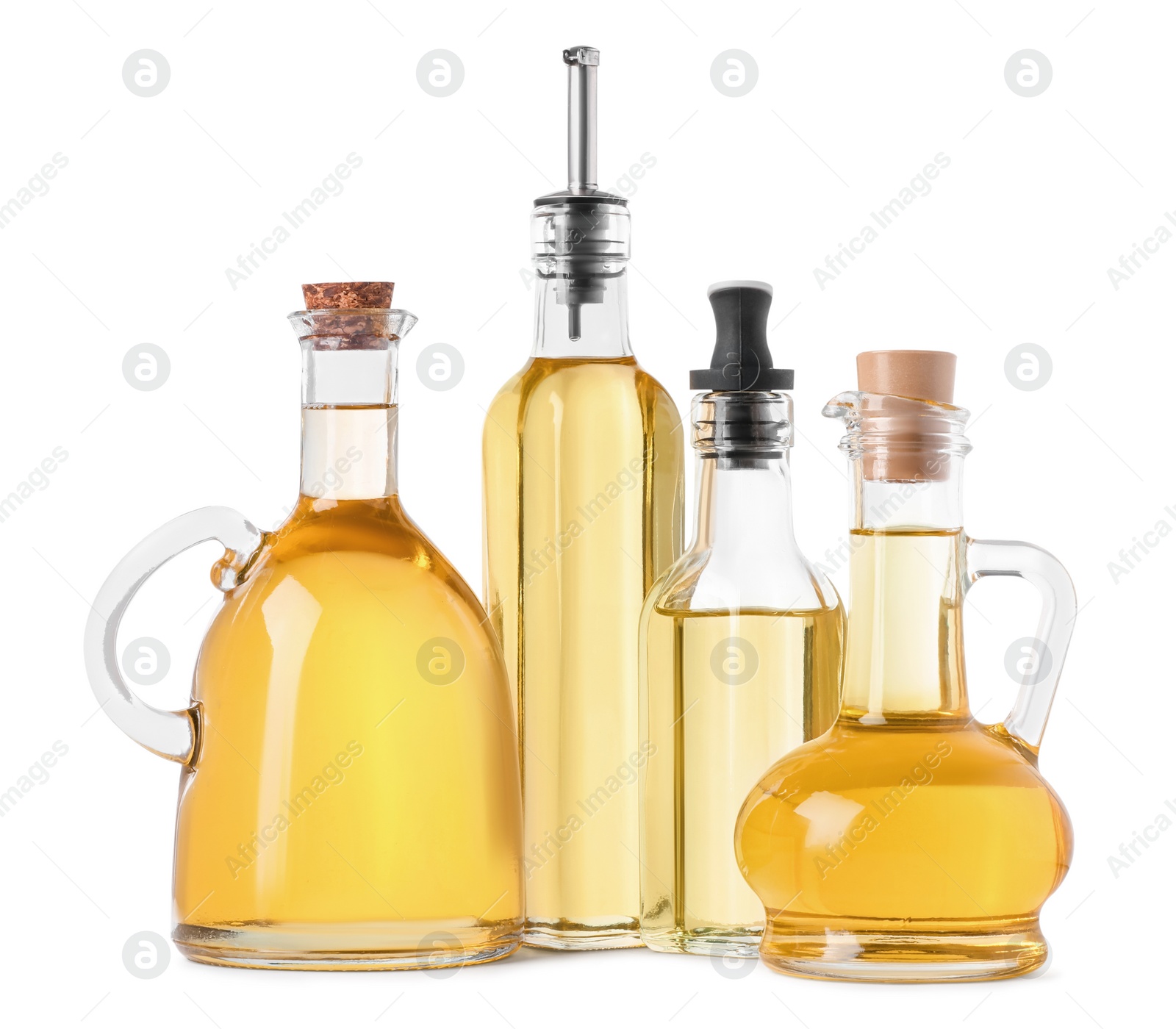 Photo of Different glass bottles of cooking oil on white background