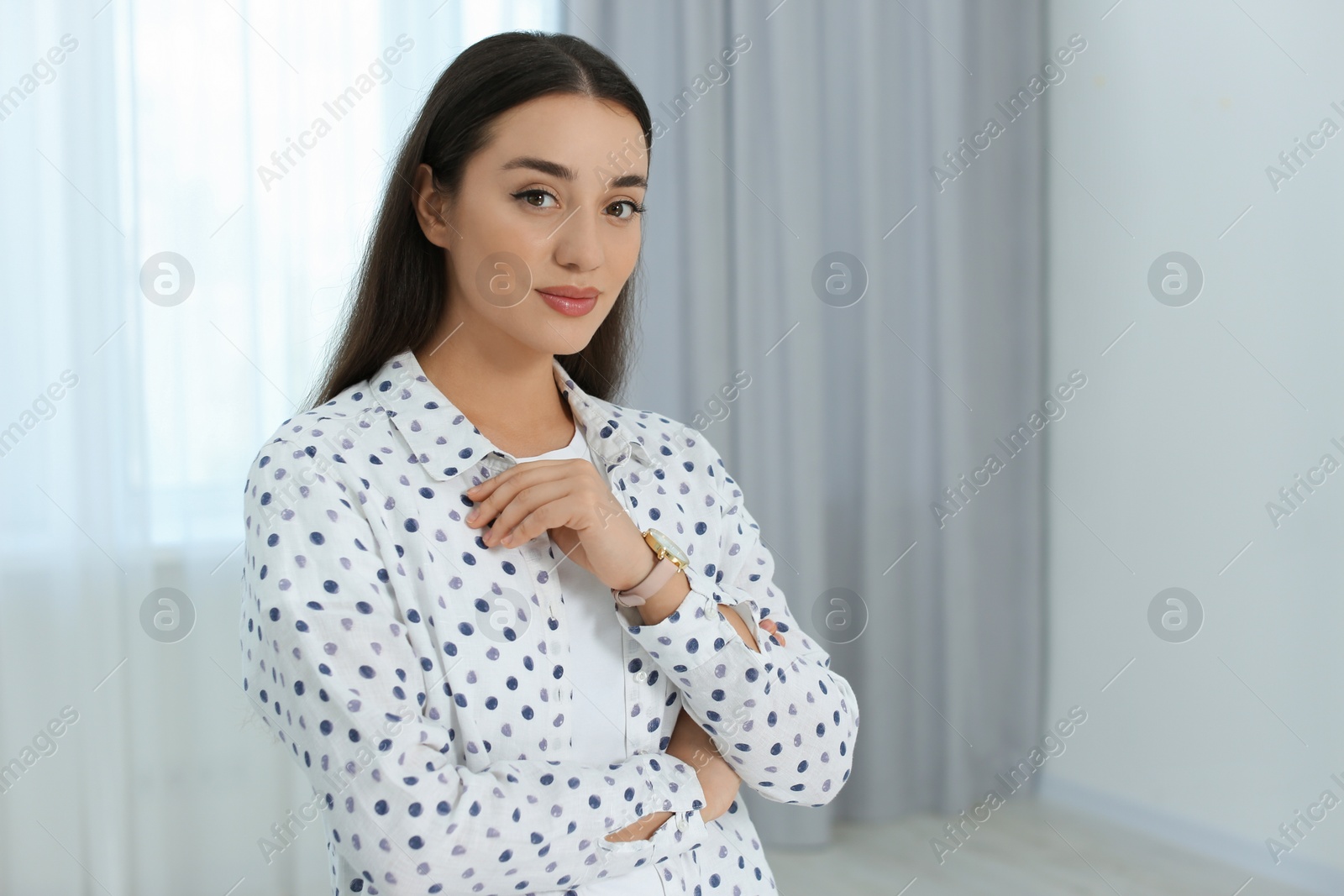 Photo of Portrait of beautiful young woman at home. Space for text