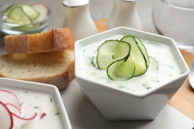 Delicious cold summer soup in bowl on table, closeup