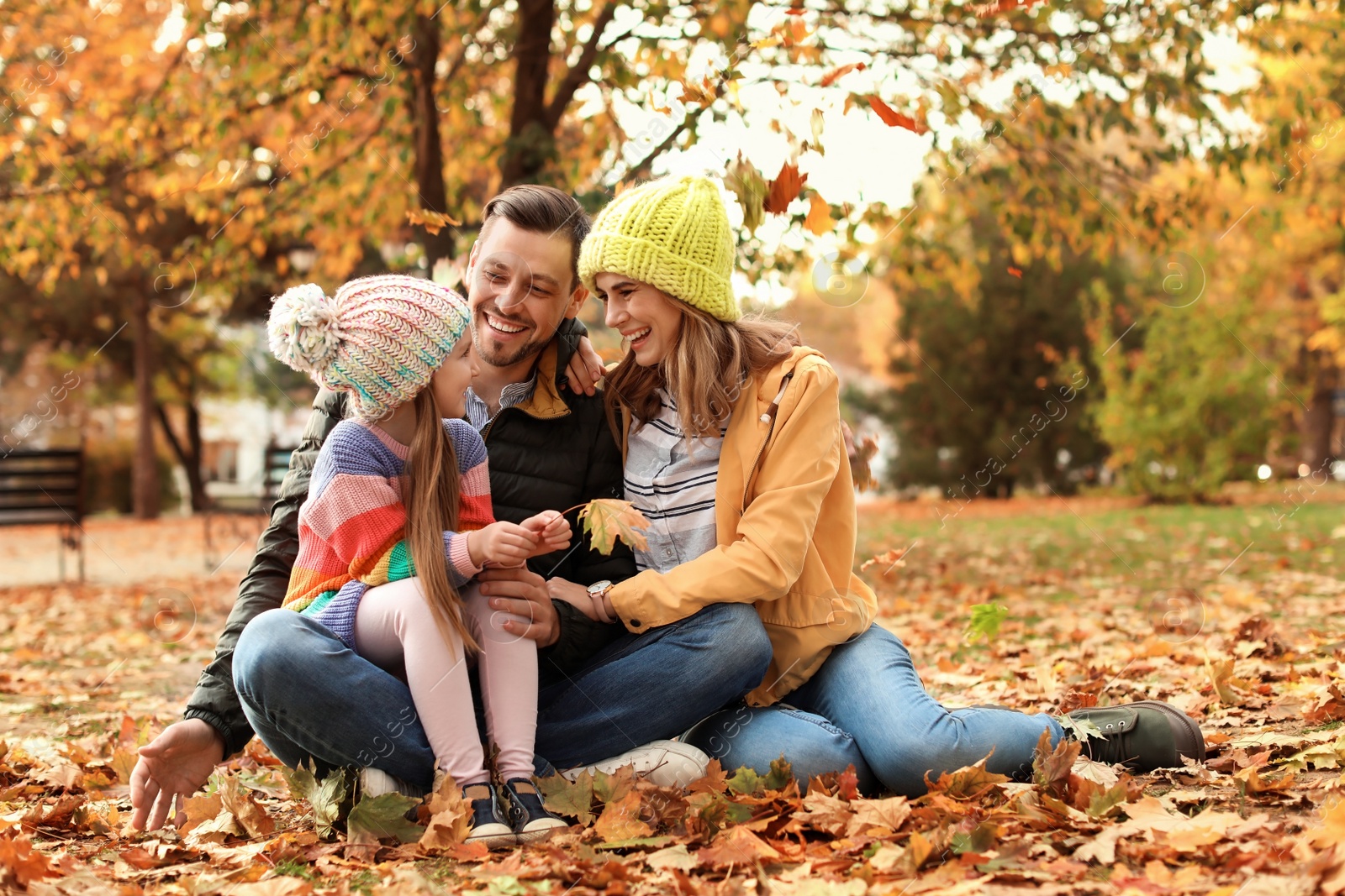 Photo of Happy family with child together in park. Autumn walk