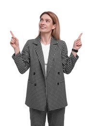 Photo of Beautiful happy businesswoman pointing at something on white background