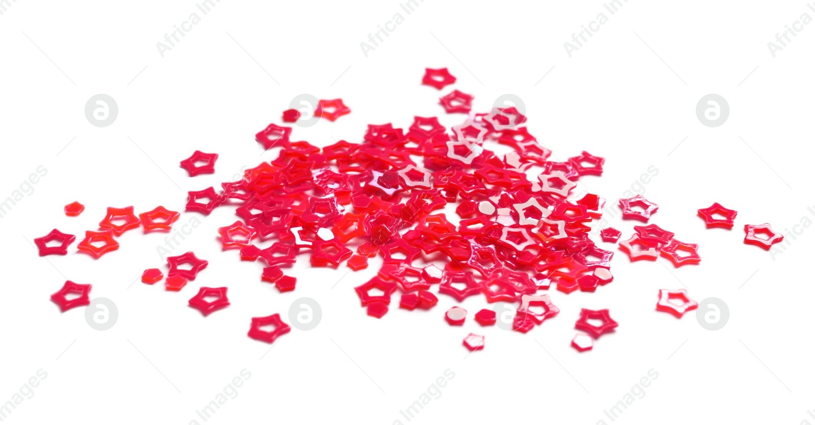 Photo of Red sequins in shape of stars isolated on white