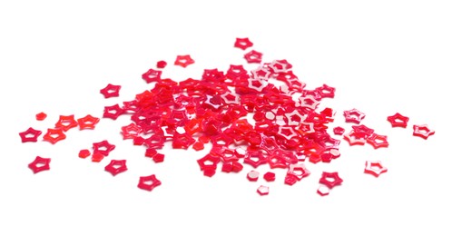 Photo of Red sequins in shape of stars isolated on white