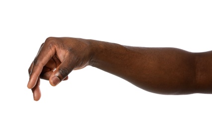 African-American man holding something in hand on white background, closeup