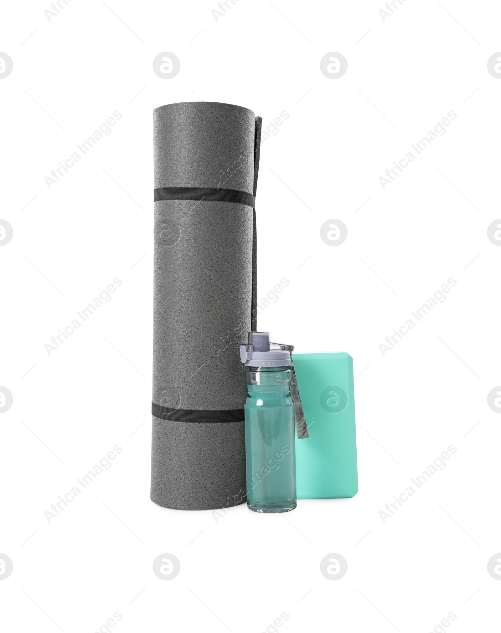 Photo of Grey exercise mat, yoga block and bottle of water isolated on white