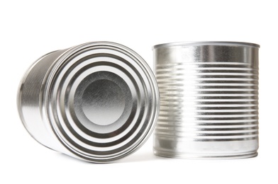 Photo of Closed tin cans isolated on white, mockup for design