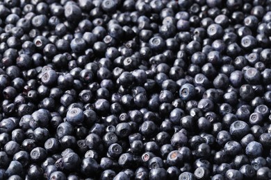 Photo of Many delicious ripe bilberries as background, closeup