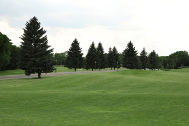 Photo of Beautiful view of golf course with green grass