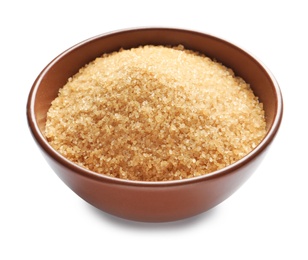 Bowl with brown sugar on white background