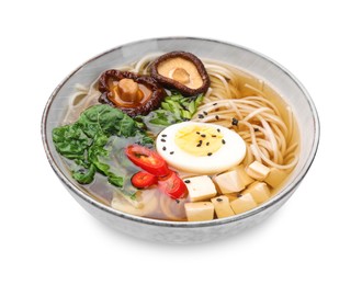 Delicious vegetarian ramen with egg, mushrooms, tofu and vegetables in bowl isolated on white. Noodle soup