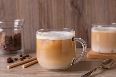 Photo of Cup of fresh coffee on wooden table