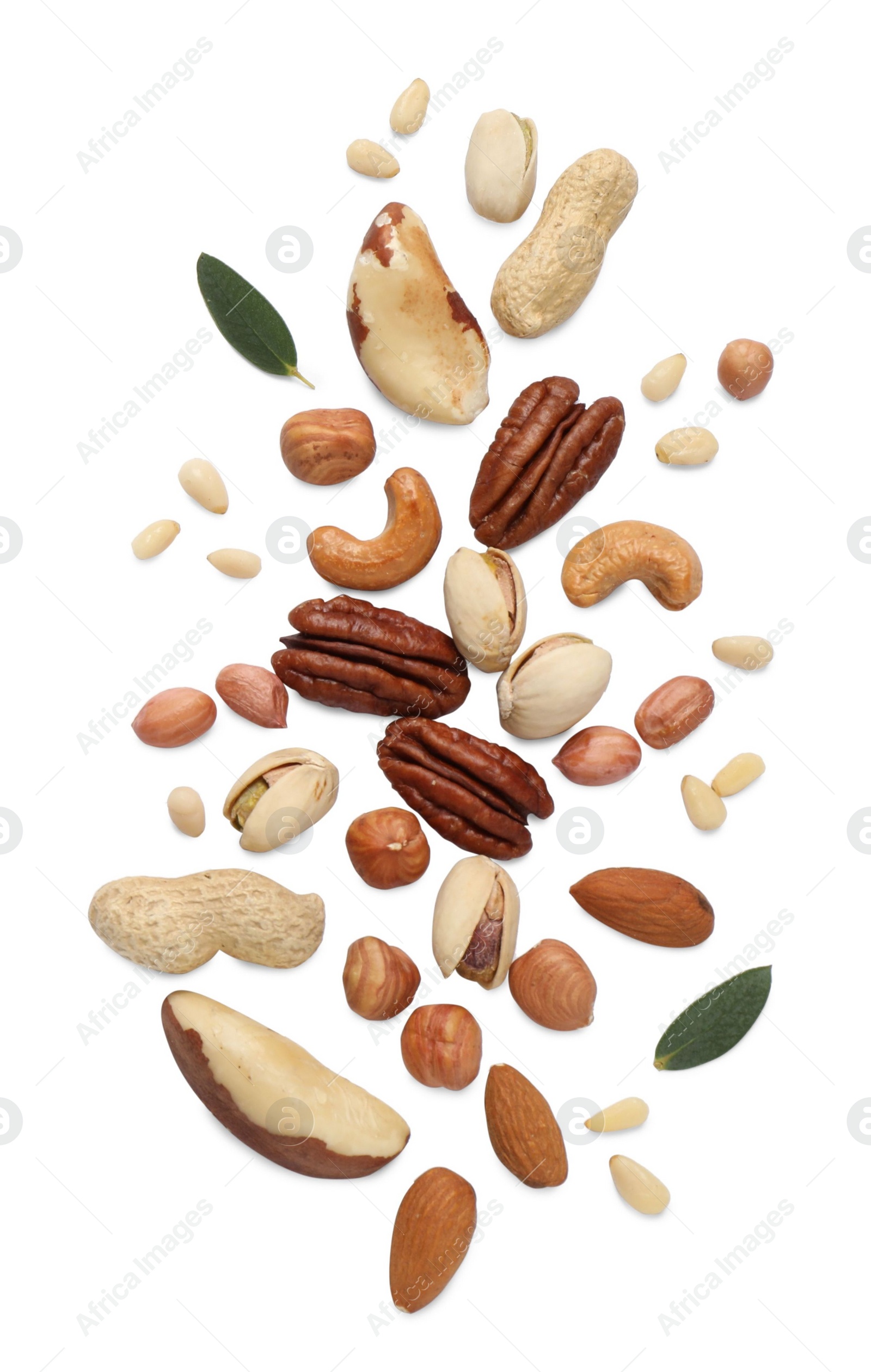 Photo of Different delicious nuts on white background, flat lay. Space for text