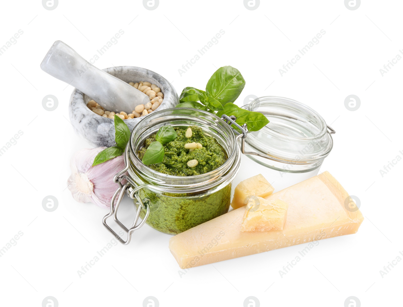 Photo of Fresh tasty pesto sauce and ingredients isolated on white