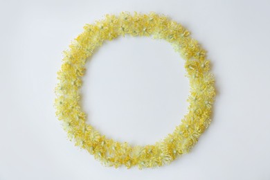 Photo of Frame made of beautiful linden blossoms on white background, flat lay. Space for text