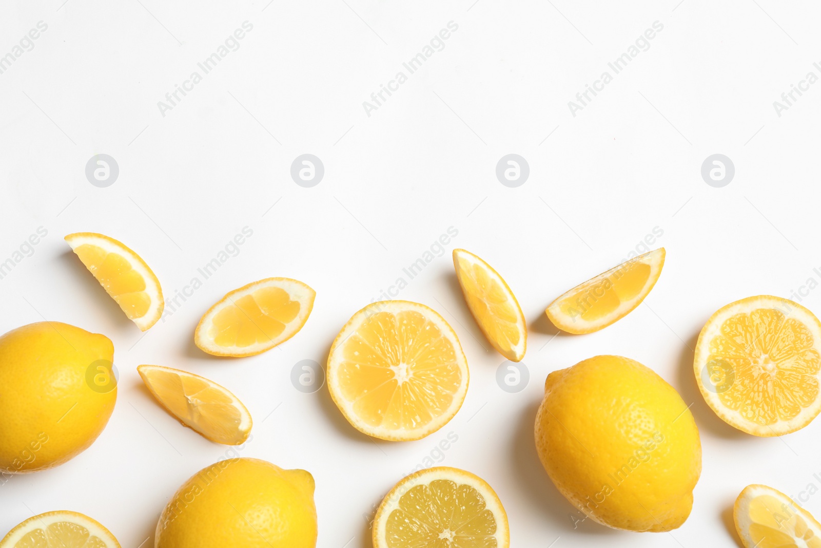 Photo of Fresh lemons on white background, top view. Citrus fruits