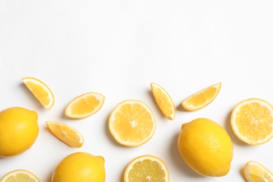 Photo of Fresh lemons on white background, top view. Citrus fruits