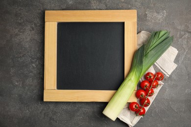 Photo of Blank chalkboard and fresh vegetables on grey table, flat lay with space for text. Cooking Classes